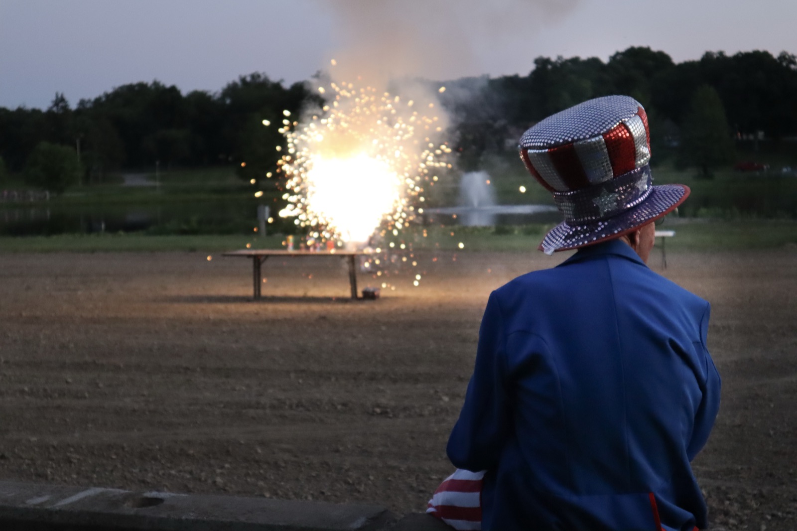 Willy watches a firework light up the field at the Willy Wednesday show