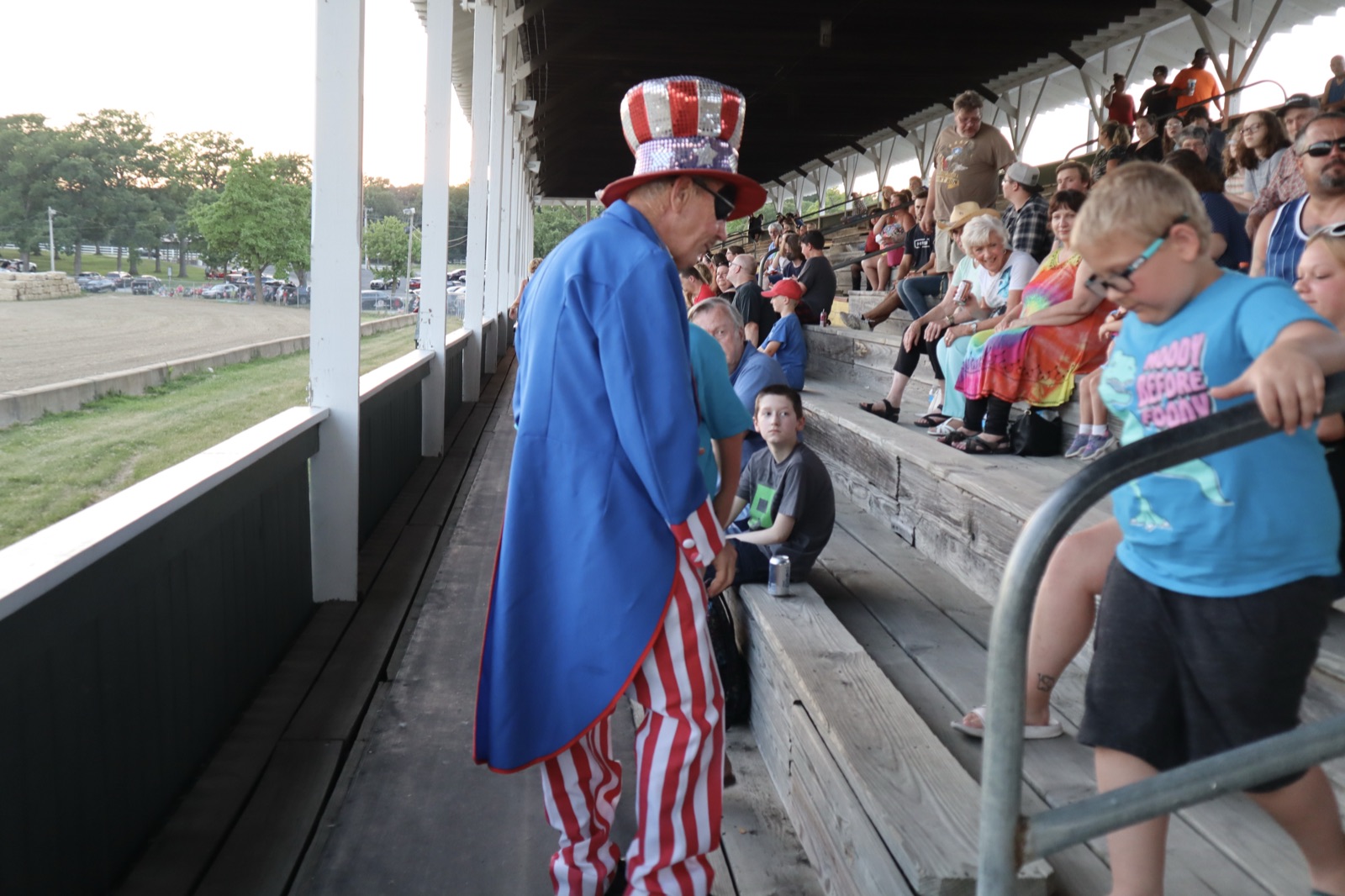 Willy greets young guests in the grandstand at Willy Wednesday